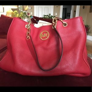 Red Michael Kors bag.